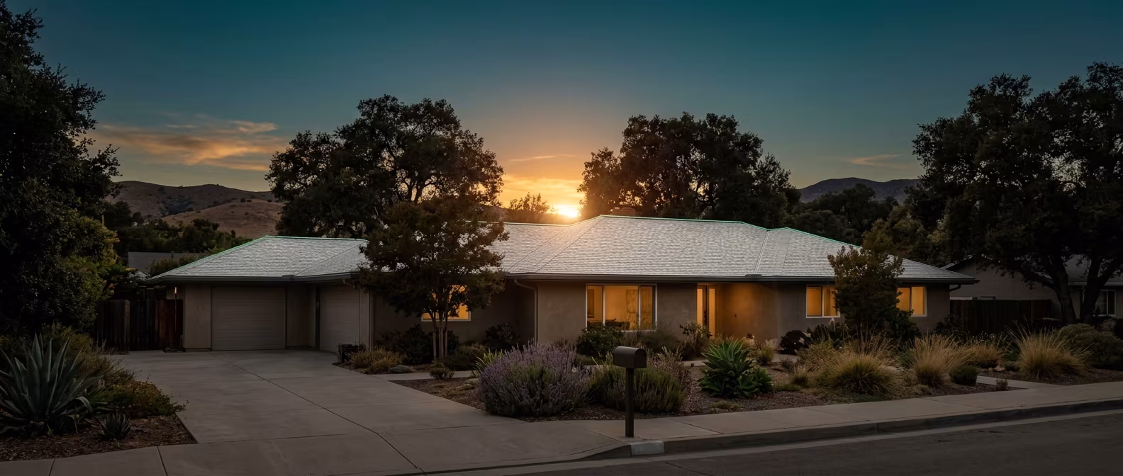 Cool roof in Woodland Hills: light-colored shingles on a ranch home at sunset